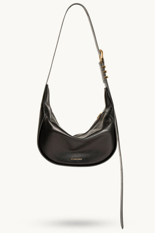 The Neveah Leather Sling Bag in Black/Gold